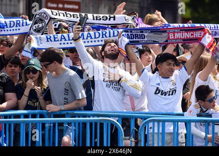 Madrid, Spain. 12th May, 2024. Fans celebrate during a ceremony of Real Madrid's celebration after winning the champion of the 2023-2024 Spanish La Liga in Madrid, Spain, May 12, 2024. Credit: Gustavo Valiente/Xinhua/Alamy Live News Stock Photo