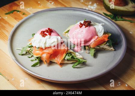 Elegant Eggs Benedict: Salmon and Avocado Delight Stock Photo