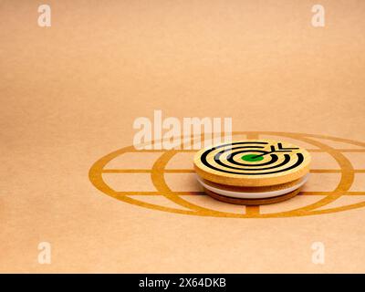 Green business and eco-friendly marketing goals on online platform concept. Big target icon on round wood badge on digital global icon on eco brown re Stock Photo