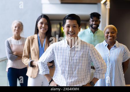 A diverse team of professionals, smiling at office Stock Photo