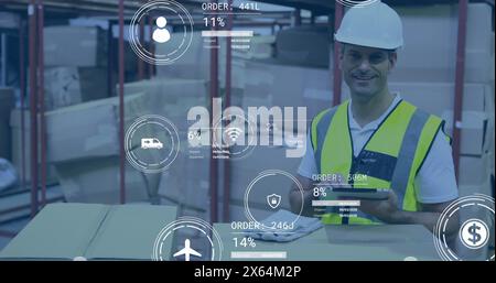 Image of data processing against caucasian male worker using tablet checking stock at warehouse Stock Photo