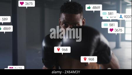 Image of falling notification bars over african american boxer practicing punches Stock Photo