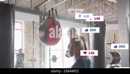 Image of multiple notification bars, african american boxer practicing punches on punching bag Stock Photo