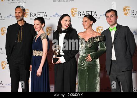 Royal Festival Hall, LONDON, ENGLAND, UK - MAY 12 2024: Paul Bazely, Louise Brealey, Kat Sadler, Lizzie Davidson and Freddie Meredith pose with the Award for Scripted Comedy for 'Such Brave Girls' in the Winners Room during the 2024 BAFTA Television Awards with P&O Cruises, London, UK. Credit: See Li/Picture Capital/Alamy Live News Stock Photo