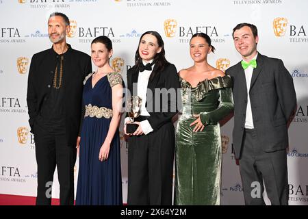 Royal Festival Hall, LONDON, ENGLAND, UK - MAY 12 2024: Paul Bazely, Louise Brealey, Kat Sadler, Lizzie Davidson and Freddie Meredith pose with the Award for Scripted Comedy for 'Such Brave Girls' in the Winners Room during the 2024 BAFTA Television Awards with P&O Cruises, London, UK. Credit: See Li/Picture Capital/Alamy Live News Stock Photo