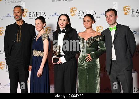 Royal Festival Hall, LONDON, ENGLAND, UK - MAY 12 2024: Paul Bazely, Louise Brealey, Kat Sadler, Lizzie Davidson and Freddie Meredith pose with the Award for Scripted Comedy for 'Such Brave Girls' in the Winners Room during the 2024 BAFTA Television Awards with P&O Cruises, London, UK. Credit: See Li/Picture Capital/Alamy Live News Stock Photo