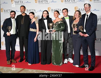 Royal Festival Hall, LONDON, ENGLAND, UK - MAY 12 2024: Paul Bazely, Louise Brealey, Kat Sadler, Lizzie Davidson and Freddie Meredith pose with the Award for Scripted Comedy for 'Such Brave Girls' in the Winners Room during the 2024 BAFTA Television Awards with P&O Cruises, London, UK. Credit: See Li/Picture Capital/Alamy Live News Stock Photo