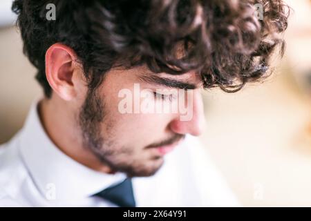 Young businessman working on a new project in a startup company office. Working in co-working space. Stock Photo