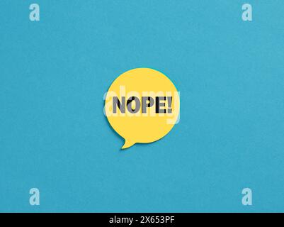 The word Nope on yellow speech bubble over blue background. Stock Photo