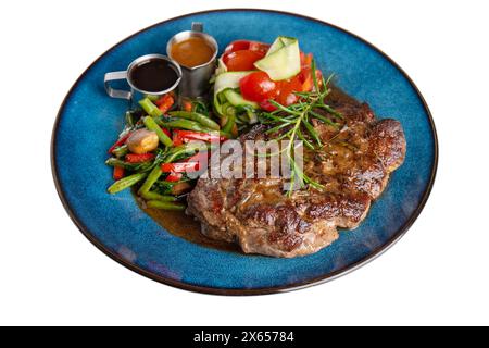 Beef Steak with Roasted Vegetables and Sauces on a Plate, White Background Isolated Stock Photo