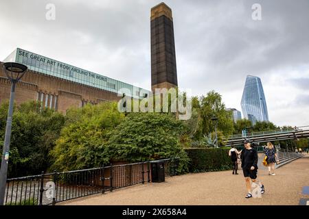 Tate Modern art gallery in London in the foyer Bankside Power Station alongside the modern No 1 Blackfriars skyscraper building, London,England,UK Stock Photo