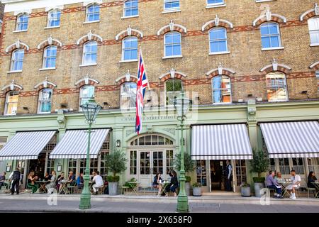 Charlotte Street hotel, 5 star hotel in Fitzrovia central London with guests sitting outside eating lunch, London,England,UK,2023 Stock Photo