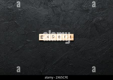 expert word written on wood block. expert text on table, concept. Stock Photo
