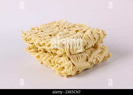 Dried corn or maize kernels on white background with spoon. Stock Photo