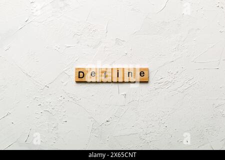 Define word written on wood block. Define text on cement table for your desing, concept. Stock Photo