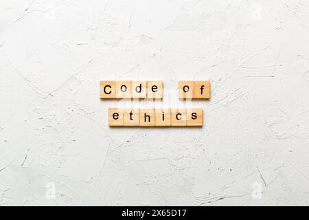 code of ethics word written on wood block. code of ethics text on table, concept. Stock Photo