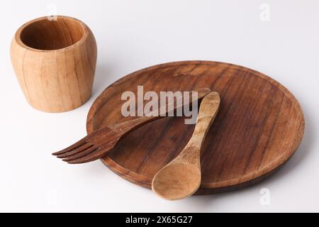 Traditional cutlery set made by wood on white background. Stock Photo