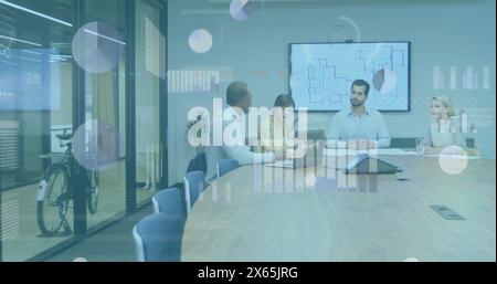 Image of statistical data processing over diverse colleagues discussing together at office Stock Photo