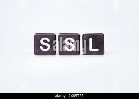 SSL (Secure Sockets Layer) text written on cubes on a white background. Stock Photo