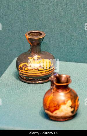 Antique ceramic decorative amphora on a white background. Clay jugs and a pot, a set of ancient utensils for drinking wine, water or milk. High qualit Stock Photo