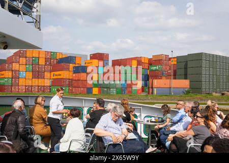 Tourists on board of a sightseeing boat sailing the harbor of Rotterdam, Netherlands Stock Photo