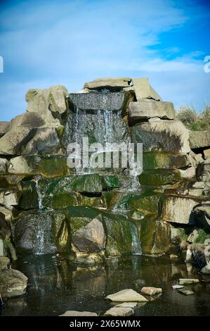 Artificial waterfall and small pool Stock Photo