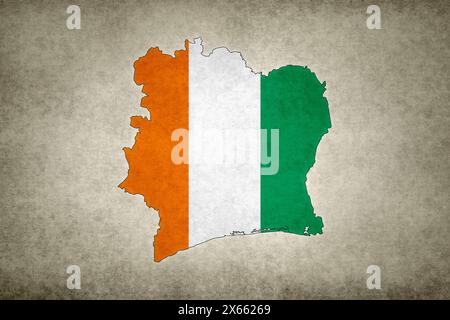 Grunge map of Ivory Coast with its flag printed within its border on an old paper. Stock Photo