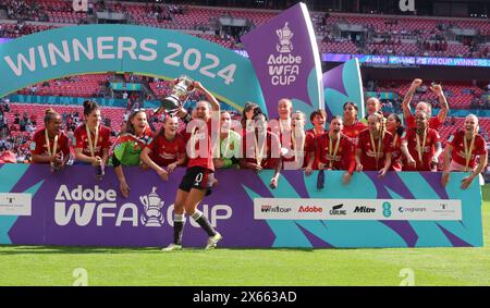 LONDON, ENGLAND - Katie Zelem of Manchester United Women celebrates with The Women's FA Cup after The Adobe Women's FA Cup Final soccer match between Stock Photo
