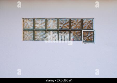 Glass blocks in white wall, Germany, Europe Stock Photo