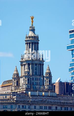 The temple-like crown of the Beaux Arts-styled David N. Dinkins Manhattan Municipal Building is capped by the gilded “Civic Fame” statue. Stock Photo