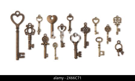 Collection of decorative vintage keys made of copper or bronze, close-up, top view, isolated on white background for decoration and design. Stock Photo