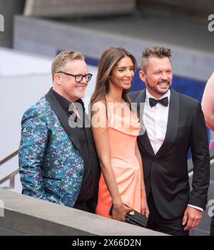London, UK. 12th May 2024 Olly Smith TV wine expert, Shivi Ramoutar food writer and TV chef with Jimmy Doherty, conservationist from Jimmy's Farm attend the BAFTA Television Awards at the Royal Festival Hall. Credit: Prixpics/Alamy Live News Credit: Prixpics/Alamy Live News Stock Photo