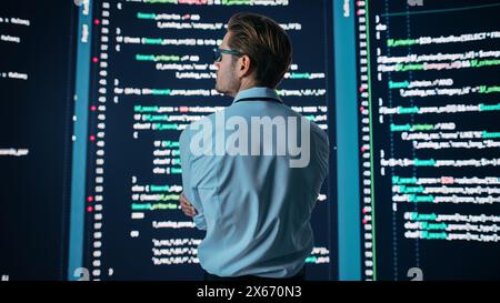 Innovative Startup: Portrait of Thoughtful Software Engineer Finding Solution, Planning Strategy, Doing Big Data Analysis. Screen Background. Programmer Developing e-Commerce App. Stock Photo