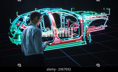 Innovative Green Energy Startup: Engineer Designing Electric Car Using Tablet Computer and Big Wall Screen to Analyse Prototype. Concept for Sustainable Environmnetally Friendly Carbon Neutral Vehicle Stock Photo
