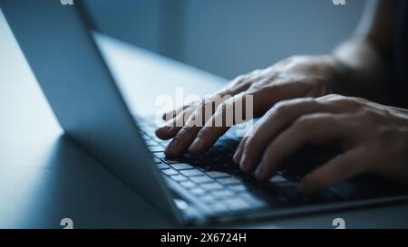Close-up Static Shot: Person Typing on the Laptop Keyboard. Working, Writing Emails, Using Internet, Doing Coding, Programming Software, Developing e-Commerce Project or e-Business Customer Service Stock Photo