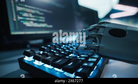 Close-up on Hands: Programmer With Disability Using Prosthetic Arm to Work on Illuminated Computer Keyboard. Swift and Natural Use of Myoelectric Bionic Hand To Type Code for Software at Night. Stock Photo