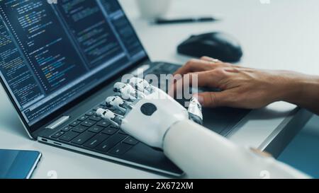 Close-up on Hands: Programmer With Disability Using Prosthetic Arm to Work on Laptop Computer. Specialist Swift and Natural Use of Myoelectric Bionic Hand To Type Code for Software Stock Photo