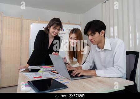 Brainstorm team of creative web graphic designer planning. Creative designers present ux ui to team. Designers team working meeting in office Stock Photo