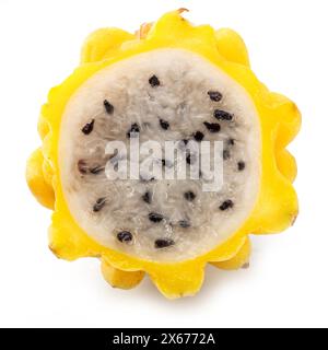 Yellow dragon fruit slice with white flesh and crunchy black seeds  isolated on white background. Stock Photo