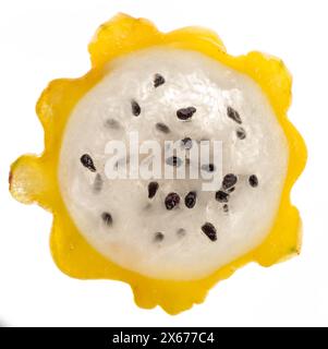 Yellow dragon fruit slice with white flesh and crunchy black seeds  isolated on white background. Stock Photo