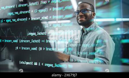 Real Office: Professional Black IT Programmer Working on Desktop Computer. Male Website Developer and Software Engineer Developing App, Video Game. Shot with Visual Effects of Running Code. Stock Photo