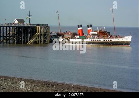 The Waverley paddle steamer stops at Penarth Pier, South Wales during a trip around the Bristol Channel in the evening sun. Stock Photo