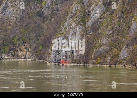 Tekija, Serbia - March 15, 2024: Trajan Plaque Historic Landmark Tabula Trajana Relic in a Danube River Gorge Honoring Construction of a Roman Militar Stock Photo