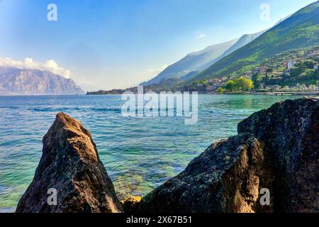 Distant View Across Lake Garda to the Small Town of Malcesine Stock Photo