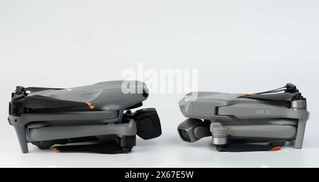 New York, USA - May 11, 2024: New generation of DJI air drone next to older 2s model against each other Stock Photo