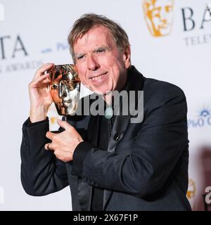 London, UK. 12th May, 2024. Timothy Spall poses with his Leading Actor BAFTA photographed backstage in the press room BAFTA TV Awards with P&O Cruises 2024. Picture by Julie Edwards./Alamy Live News Stock Photo