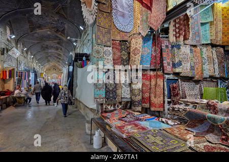 A selection of Termeh, traditional Persian handwoven cloth embroidered with silk, displayed in a handicraft store at Vakil Bazaar. Shiraz, Iran Stock Photo