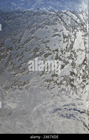 Ice patterns on a window at -42f degrees at sunrise in winter. Yaak Valley, Montana. Stock Photo