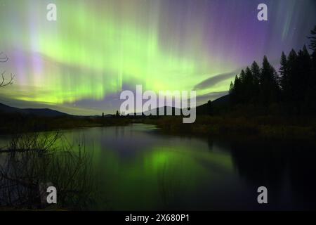 Northern Lights over the Yaak River on May 11, 2024. Lincoln County, northwest Montana. (Photo by Randy Beacham) Stock Photo