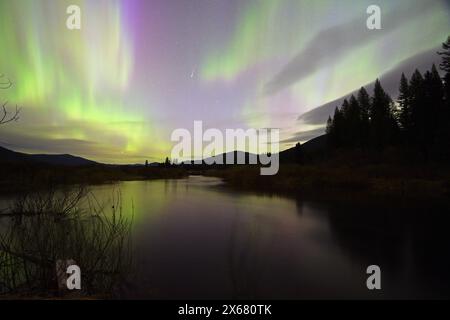 Northern Lights and a shooting star over the Yaak Valley on May 11, 2024. Lincoln County, northwest Montana. (Photo by Randy Beacham) Stock Photo